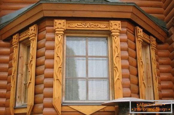 Carved platbands for windows in a wooden house, photo 14