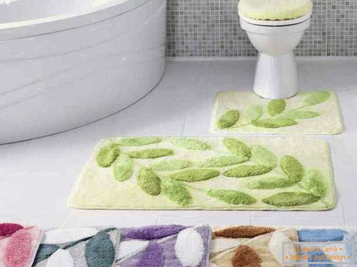 For the design of the bathroom mats are used in a single color solution. The same design makes the image of the interior complete and stylish.