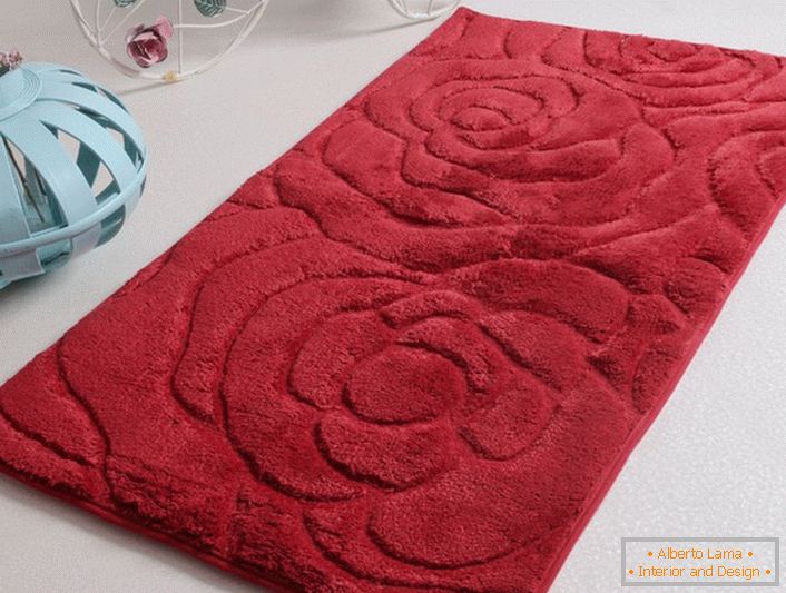 Bath mat made of soft nap with a textured image of flowers perfectly fits in the bathroom, decorated in modern style or country.