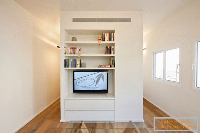 The living room of a rectangular studio apartment in Tel Aviv
