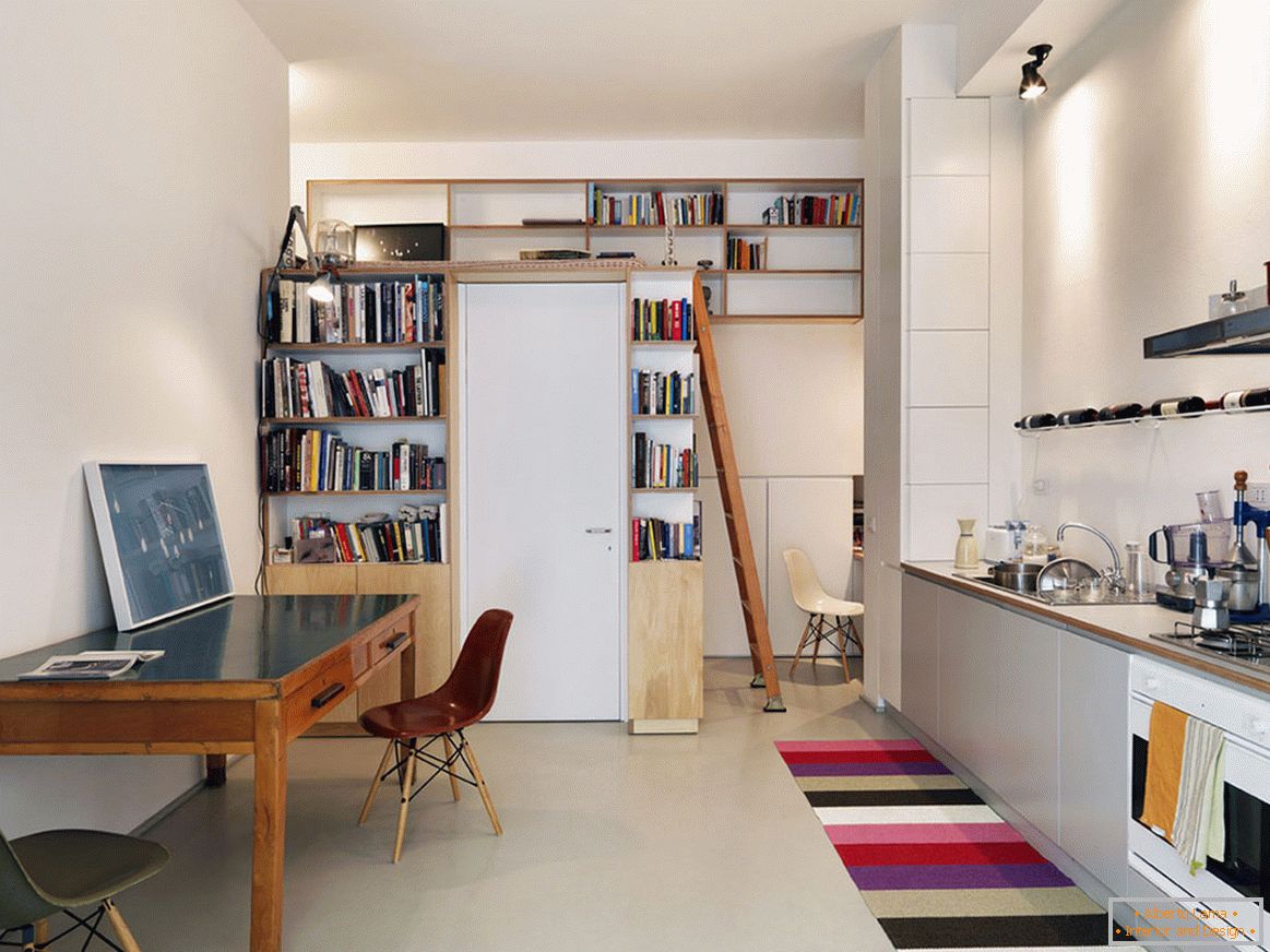 Retractable bed in the interior of a small apartment