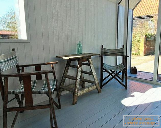 Interior of the hut in the woods: simple furniture