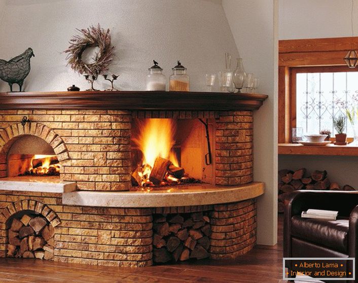 Furnace-fireplace made of bricks is equipped with storage compartments for firewood. An interesting design solution for the hallway of a house or a hall.