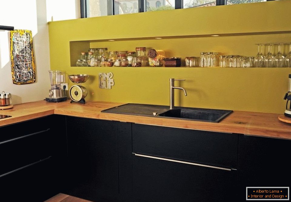 Contrast of black furniture and a yellow apron