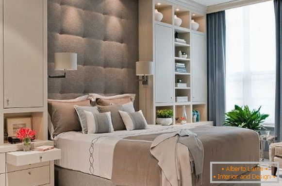 Bed with a high soft headboard beige gray