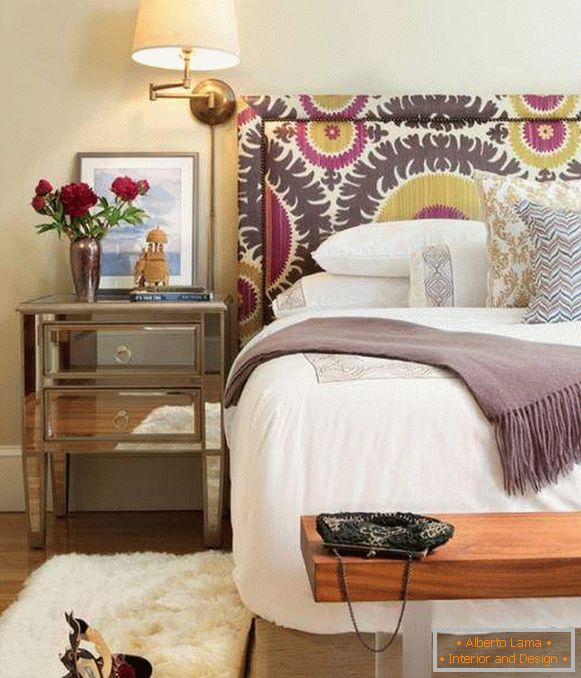 Bright beds with a soft headboard in the interior - photo