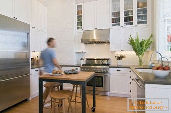 Wooden dining table with wheels for a small kitchen