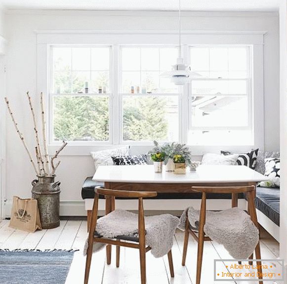 Dining table white in the interior of the kitchen