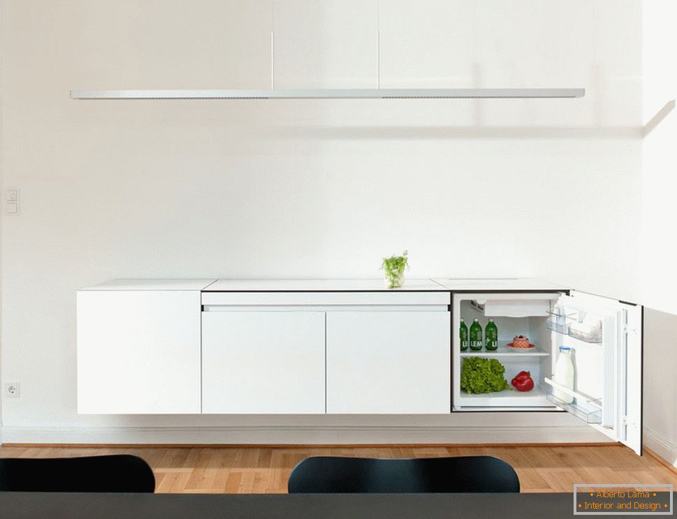 Stylish kitchen design of small sizes - зелень на столике