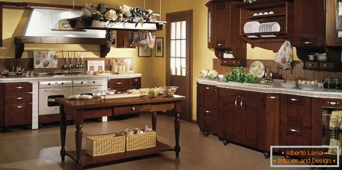 The correct example of decorating the kitchen in country style. Wicker baskets, flowers, decorative bunches of grapes - create an atmosphere of coziness in the kitchen.