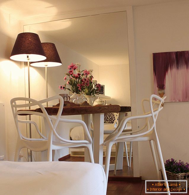 Dining room of a small studio apartment in Milan