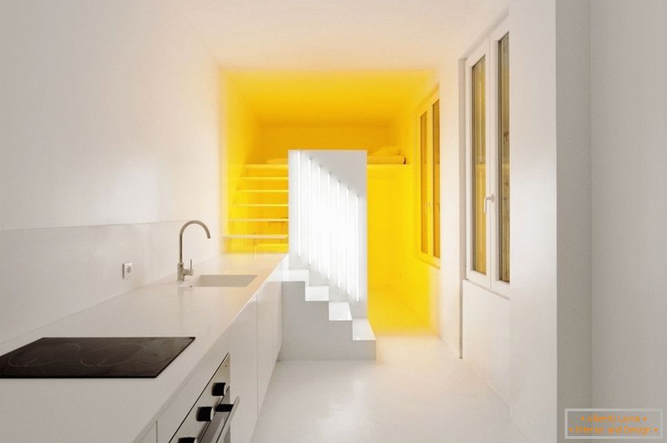 Yellow lighting in a white apartment