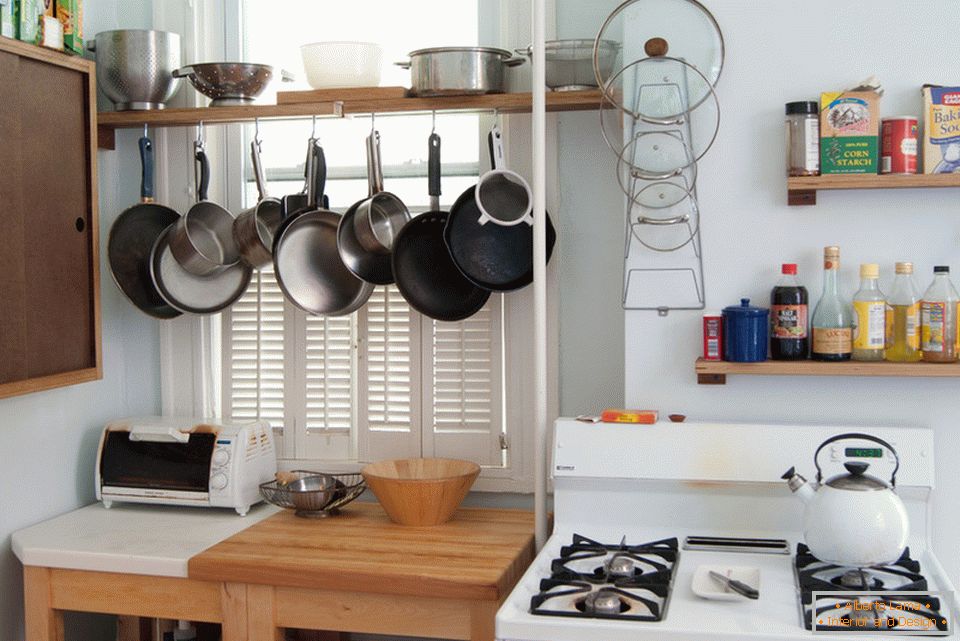 Dishware storage systems in the interior of a small kitchen