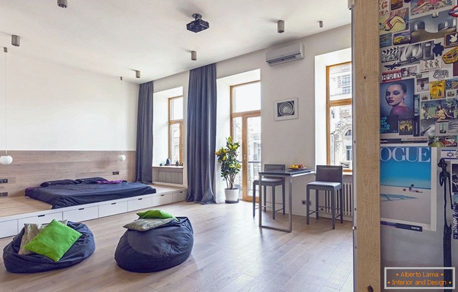 Unusual interior of a one-room apartment, decorated in blue