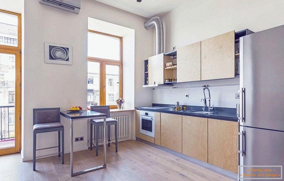 A small dining table in a one-room apartment