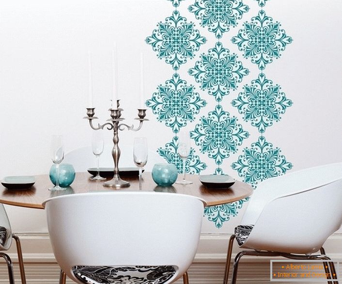 Decoration of a part of the wall with ornament from vinyl stickers revived the interior of the spacious living room.
