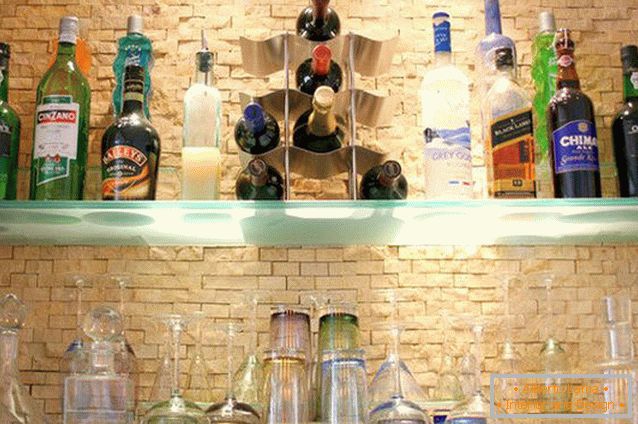 Bottles on glass shelves