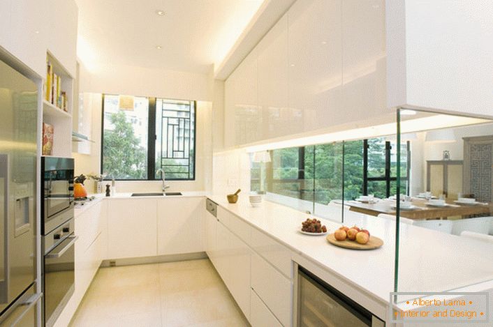 The kitchen is separated from the living room by a decorative glass wall. An interesting solution for interior in the style of hi so.