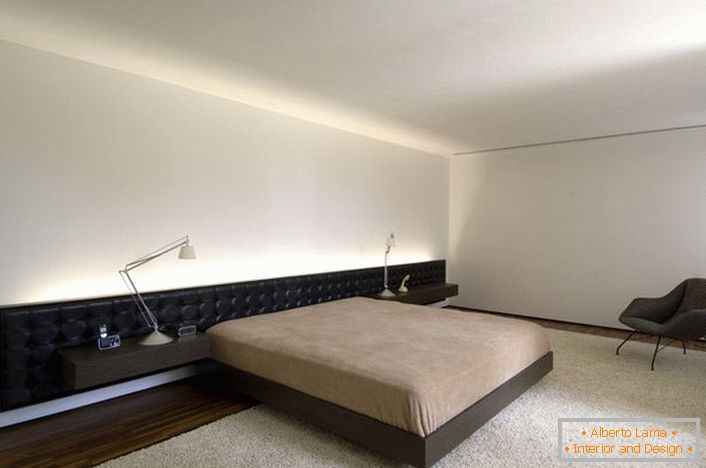 The bed with an elongated soft headboard fits perfectly into the design project.