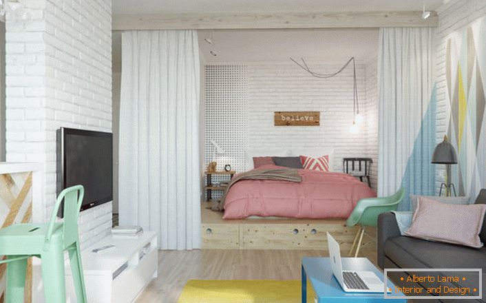 Scandinavian style is ideal, if we talk about the design of a small apartment. In the niche is located a bedroom with a large soft bed.