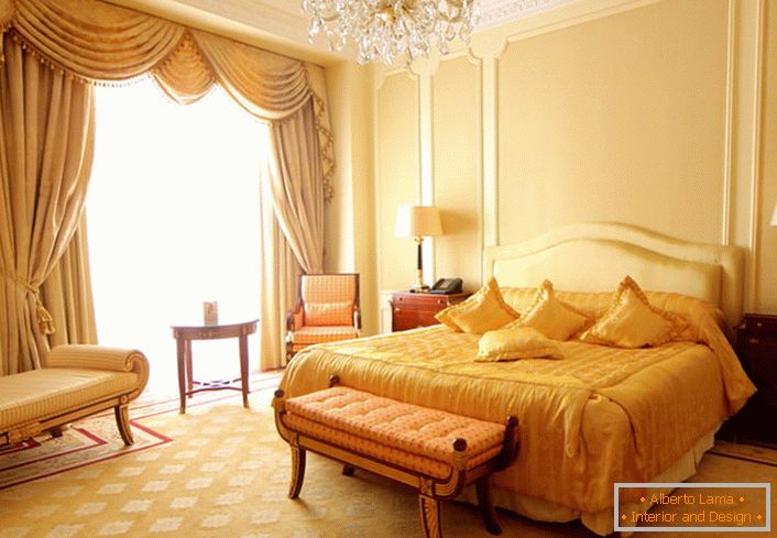Beige and gold bedroom in baroque style.