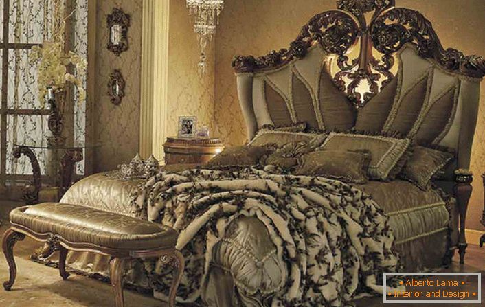 A luxurious bed in a guest bedroom in a baroque style in a country house in one of the provinces of France.