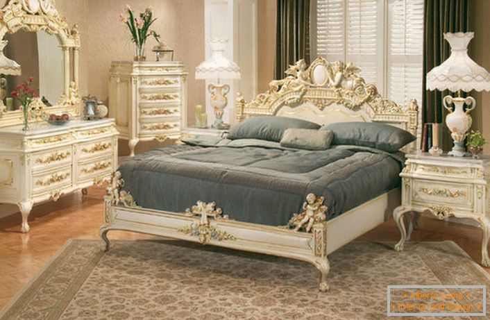 The bedroom is decorated in the style of romanticism. The main notable element is the figured carved furnishing of the furniture.