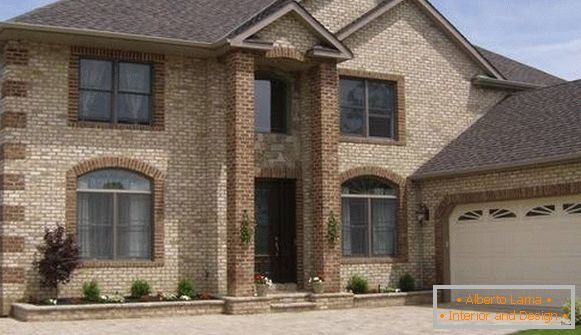 Facing a private house with artificial stone for brick