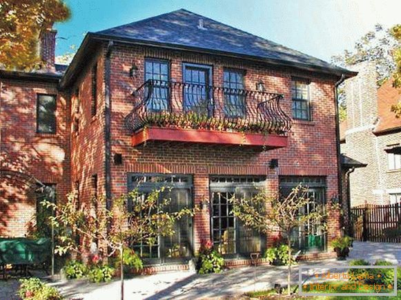 Design of the facade of a private house - photo of a paneling for a brick