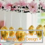 Chandelier of flowers and golden eggs