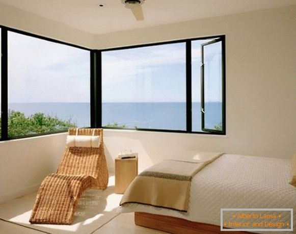 Wicker furniture in the interior of the bedroom - photo of a chaise longue