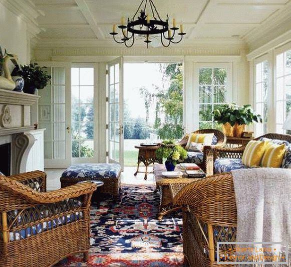 Wicker furniture in the interior - photo of the closed veranda of the living room