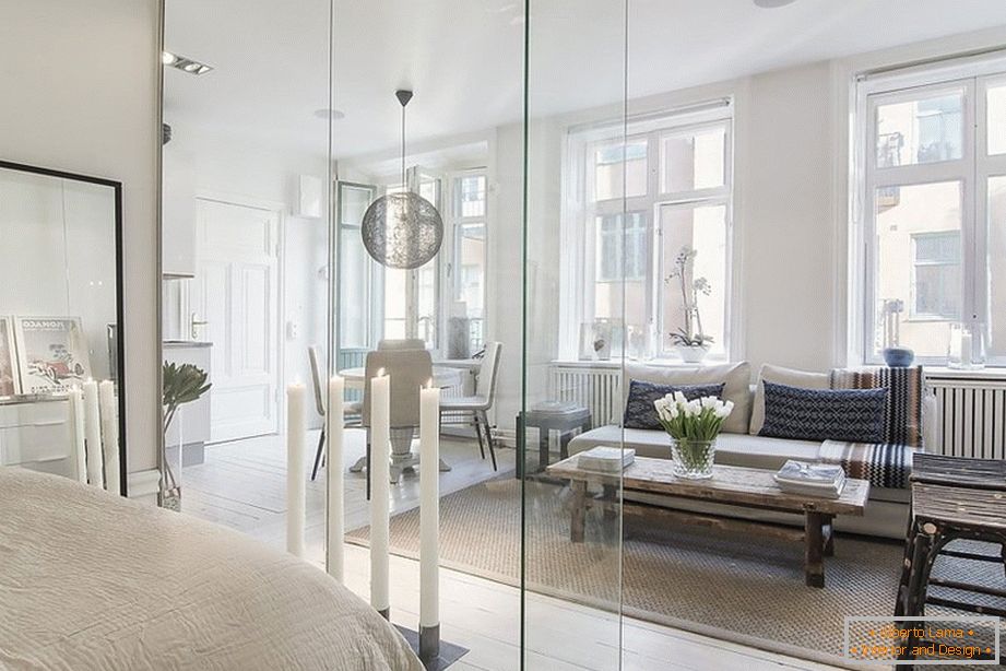 Glass partition in the interior of the studio apartment