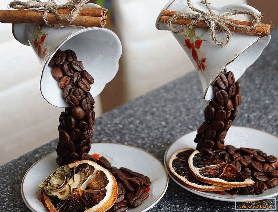 Cups with coffee, cinnamon and dried oranges