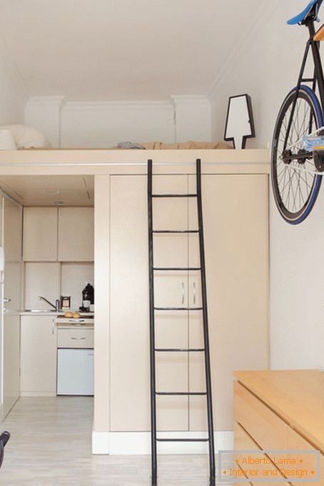 Bedroom under the ceiling in the interior of a small apartment