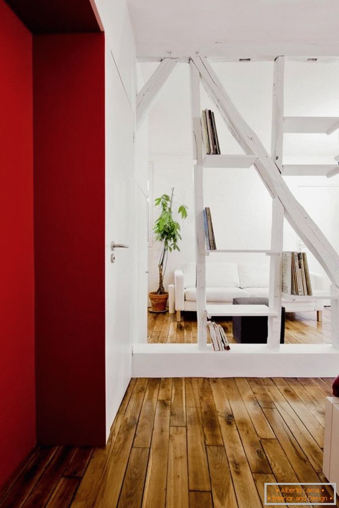 Bookcase-partition in the interior of the studio