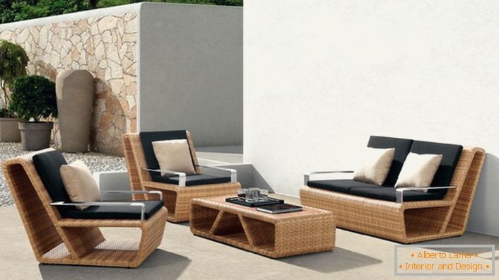 Elegant furniture made of artificial rattan in the Mediterranean villa.