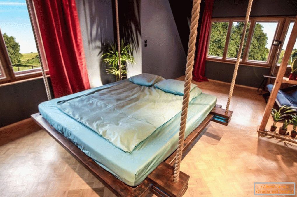 Bedroom with bed on ropes