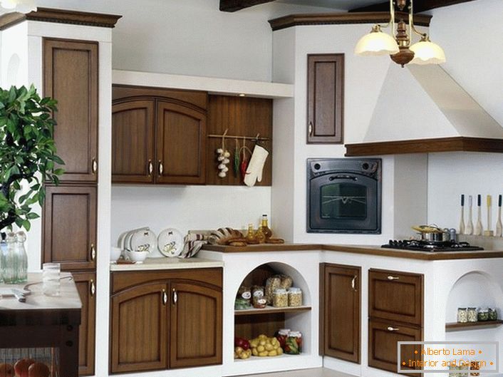 A beneficial combination of white and dark wood in the kitchen in the country style. The stove with a hood looks like a stove from fairy tales, which our parents read to us in childhood.