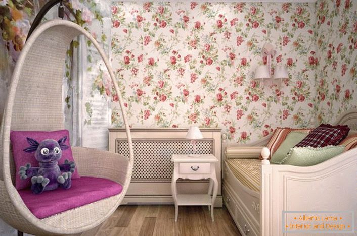 The room for a young lady is decorated in country style. In the best traditions of style the designer used wallpaper with a floral ornament.
