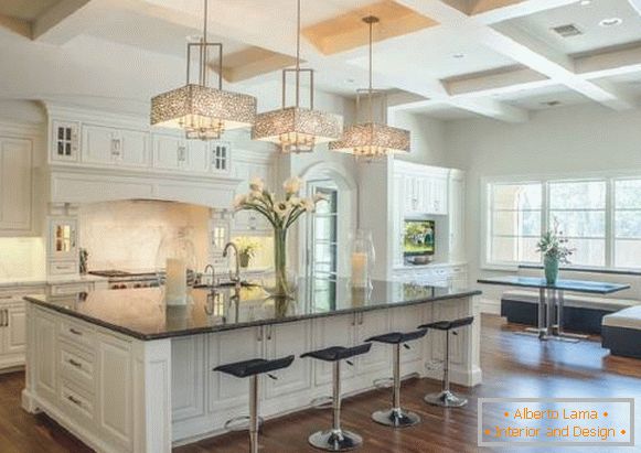 Beautiful chandeliers over a bar of a classical kitchen