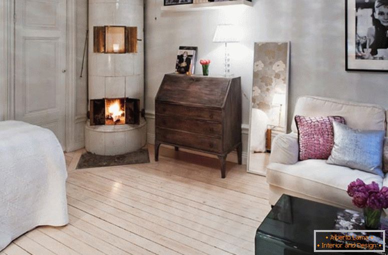 Interior of living room with fireplace in a small apartment