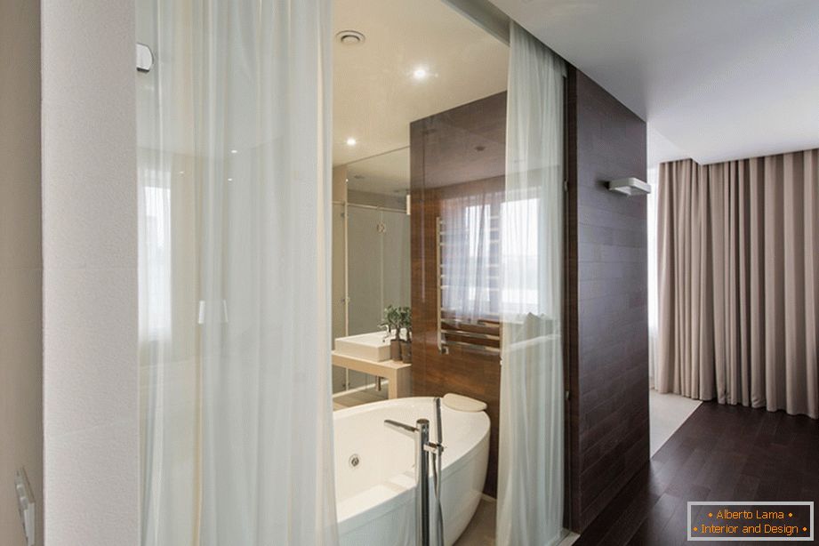 Glass wall with open curtains in the bathroom