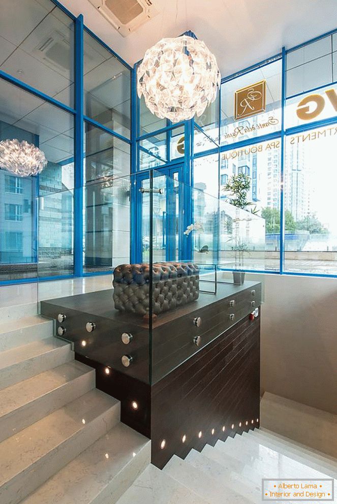 Glass walls with blue frames and steps with beautiful backlighting