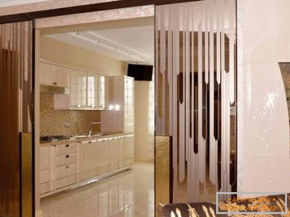 Glass sliding doors to the kitchen with a picture