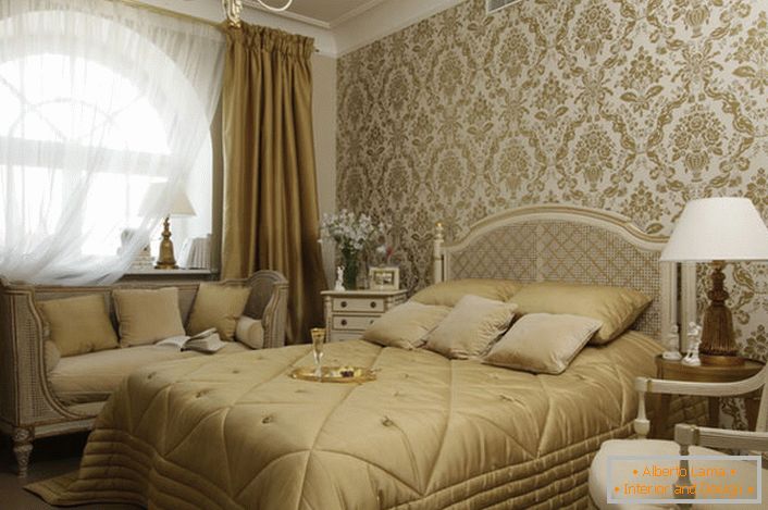 A small family bedroom in French style with a large arched window looks stylish and spectacular.