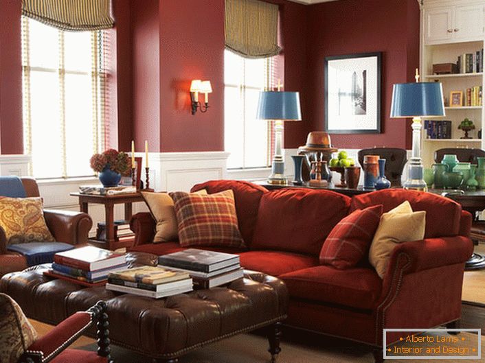 Elegant furniture in a spacious living room. Amazing harmony of red in the traditional English interior. 