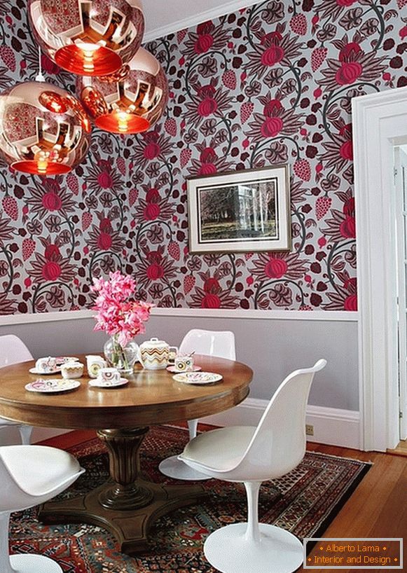 Copper lamps, elegant white chairs and a bold drawing on the wall