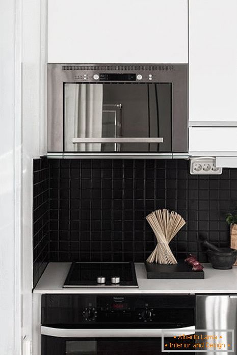Dark tile in the classic design of a small kitchen