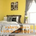 Yellow walls and gray curtains in the bedroom